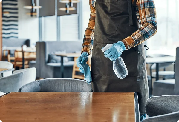 Cleaner Sanitizing Wooden Restaurant Table